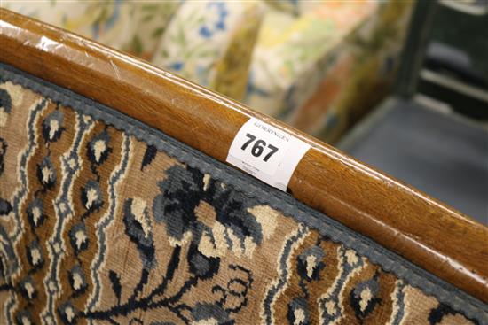 A 19th century French walnut commode chair, with an oval footstool, W.2ft 1in. H.3ft 6in.